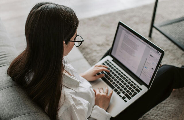 Freelance writer using her laptop to work on an assignment.