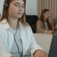 Freelance transcriber working on her laptop.