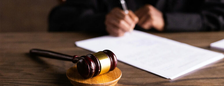 Close view of a judge reviewing a document that's been checked by a transcript proofreader.