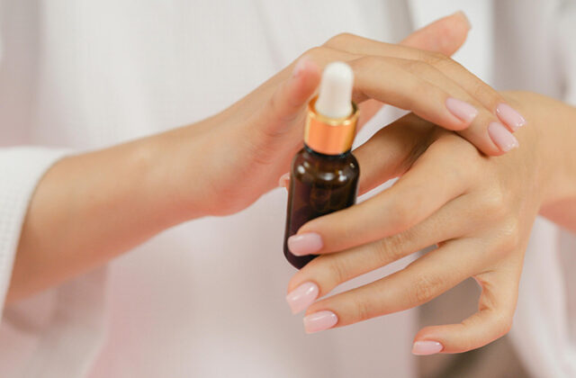 Woman testing essential oils on her wrist for Amazon Vine.