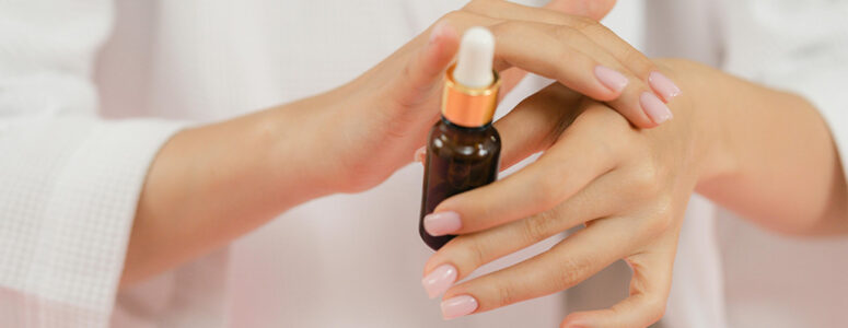 Woman testing essential oils on her wrist for Amazon Vine.