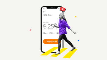 Woman walking in front of a smartphone showing a pedometer representing apps that pay you to walk