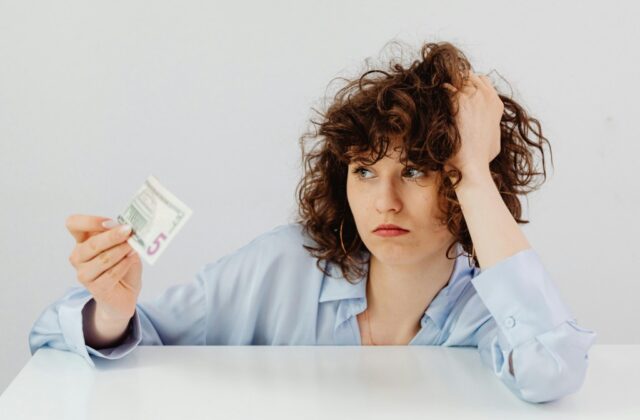 A job hunter contemplating their finances after declaring bankruptcy.