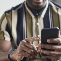 Man using Clickworker to hunt for microtasking work on his phone.