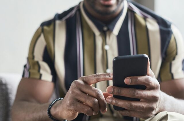 Man using Clickworker to hunt for microtasking work on his phone.