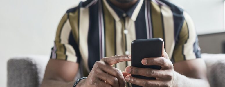 Man using Clickworker to hunt for microtasking work on his phone.