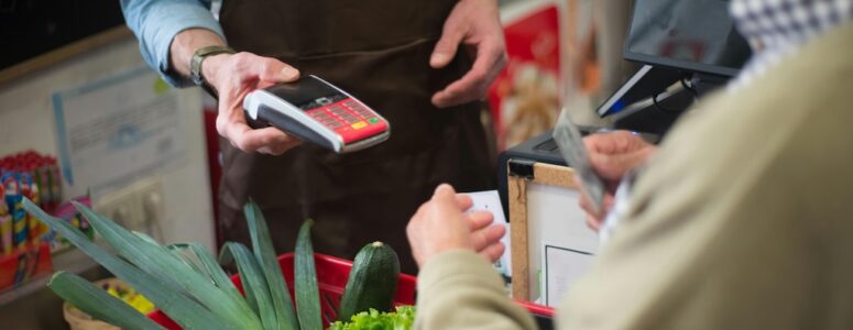 Customer receiving a receipt at a store before scanning it with CoinOut.
