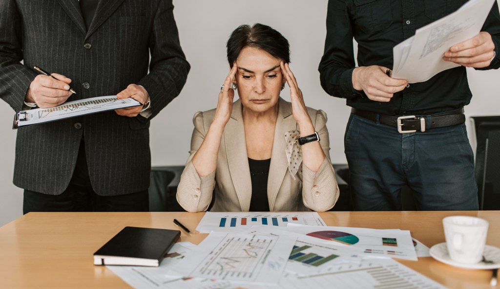 A company executive overwhelmed by a company's bankruptcy.