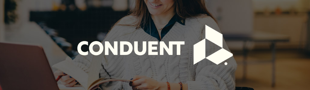 Conduent logo against a darkened background showing a smiling freelancer looking in a notebook
