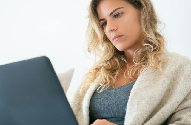 Contently freelancer working on her laptop.