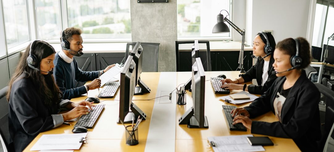 Image of customer service representatives working in an office.