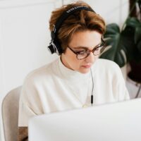 Transcriber for DailyTranscription.com working at her laptop.