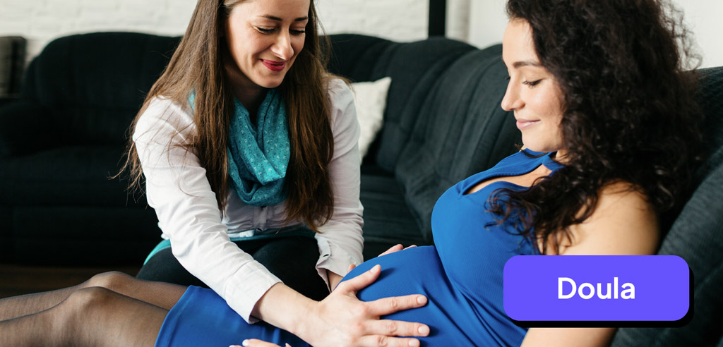 Doula providing support to a pregnant woman