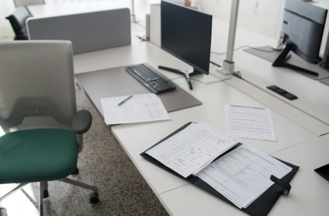 An empty office with abandoned paperwork.