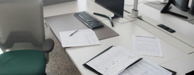 An empty office with abandoned paperwork.