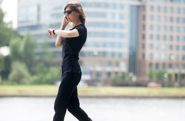 Woman walking to earn extra money with the Evidation app.