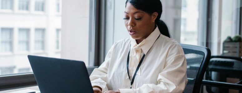 Female employee working on her laptop.