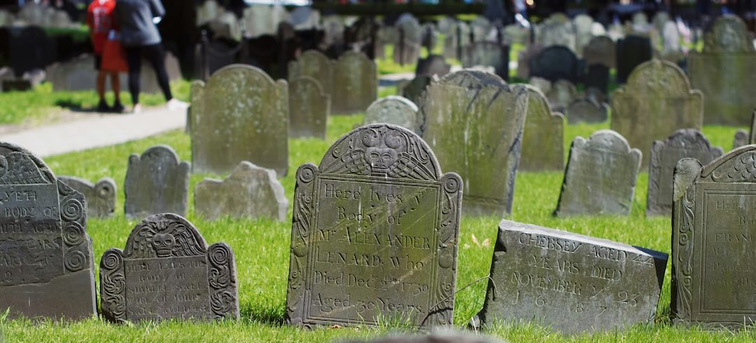 An image of gravestones in a cemetery.