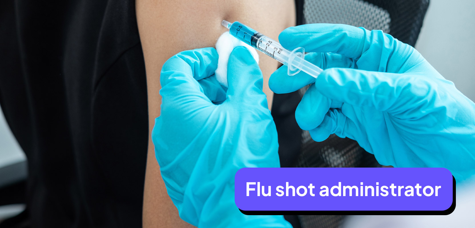 Nurse with gloved hands injecting a flu shot into person's arm