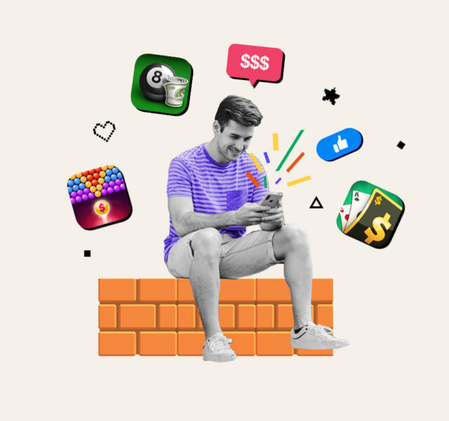 Man sitting on wall playing a game on his phone surrounded by logos of games that pay real money
