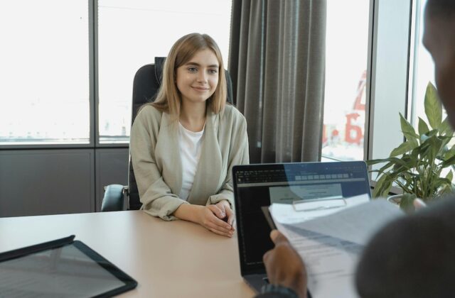 Young woman being interviewed for a job.