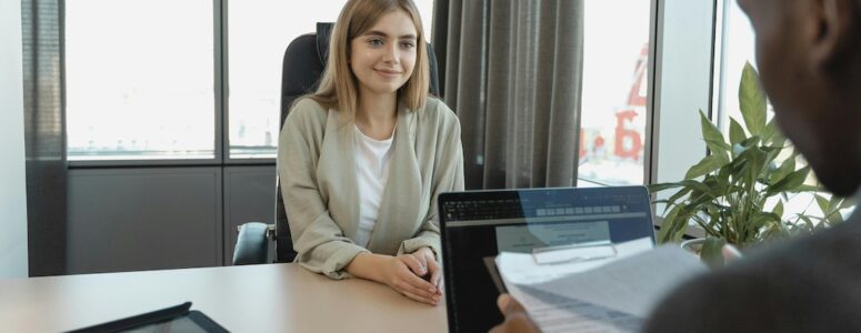 Young woman being interviewed for a job.