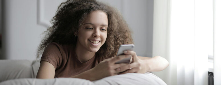 Woman getting paid to chat with people on her phone.