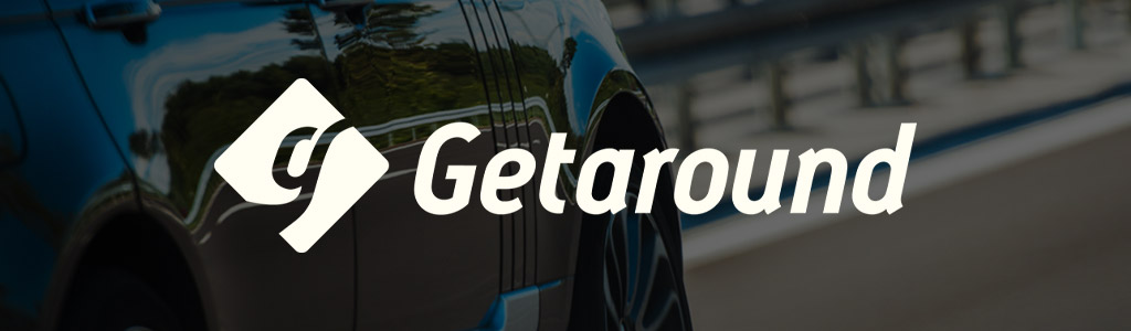 Getaround logo against a darkened background showing a car being driven