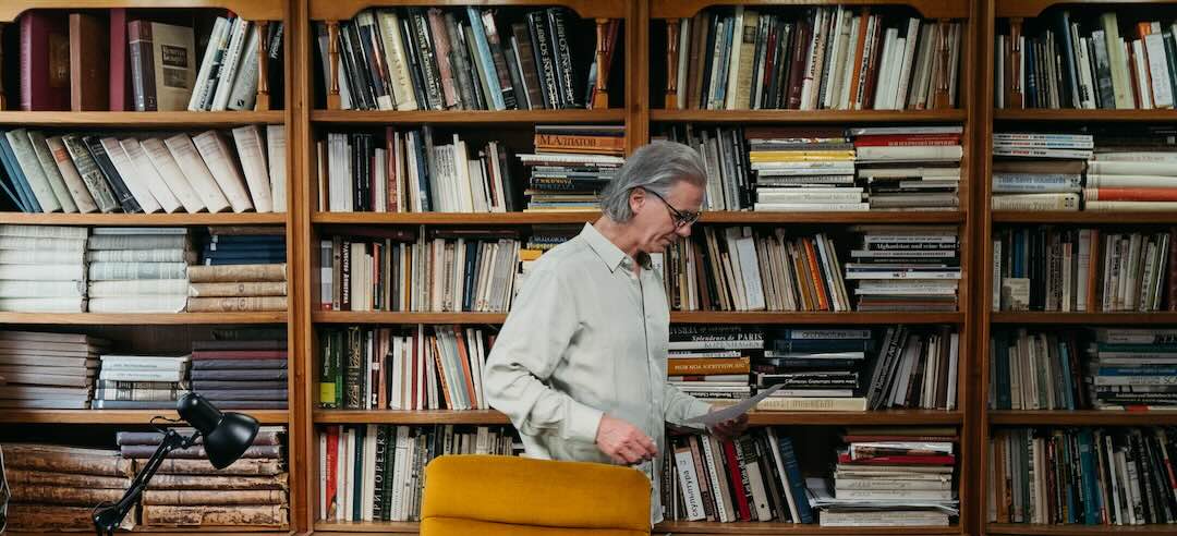 Historian examining a document in a library.