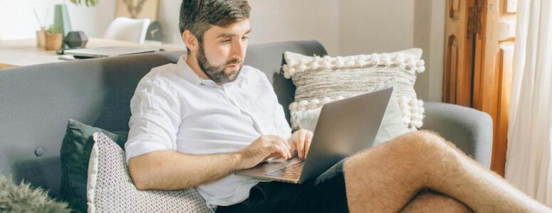 Man using his laptop while passively sharing his bandwidth on Honeygain.