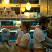 Two part-time workers in a restaurant.