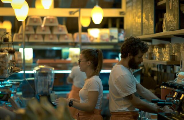 Two part-time workers in a restaurant.