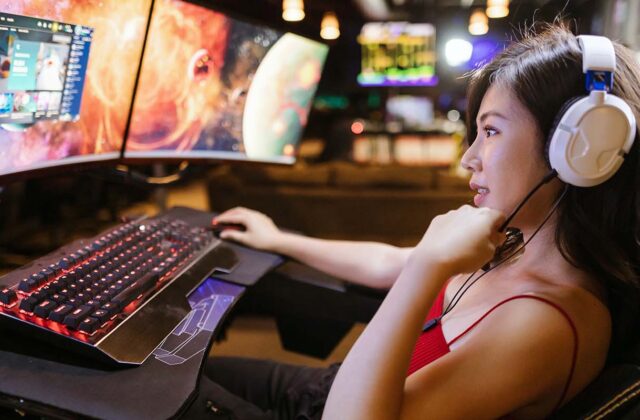 Twitch streamer sitting at her computer.