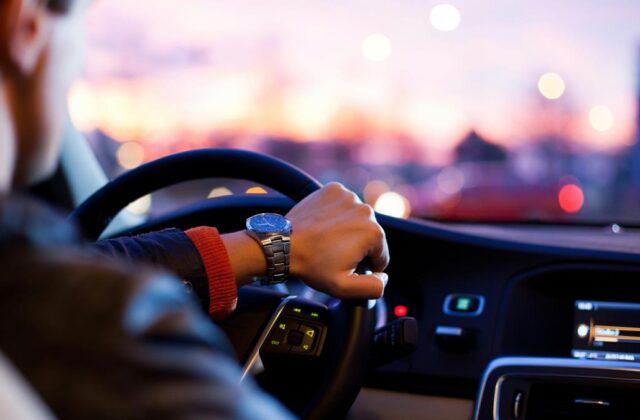 Rideshare driver behind the wheel of his car.