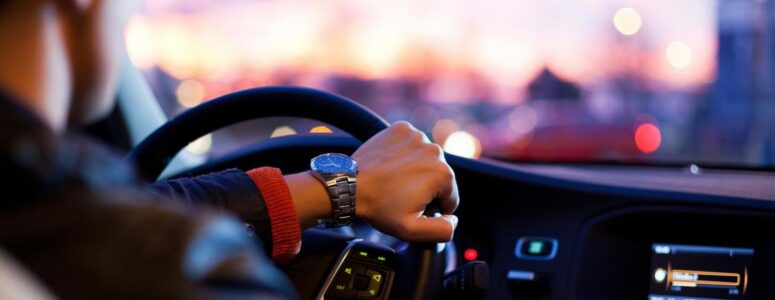 Rideshare driver behind the wheel of his car.