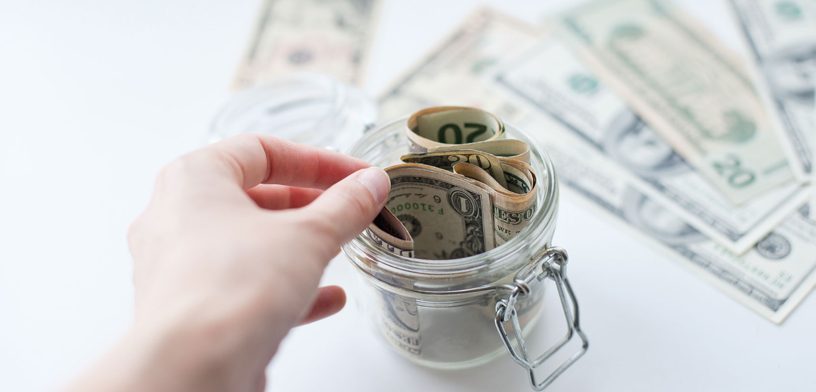 Uber tip money in a glass jar