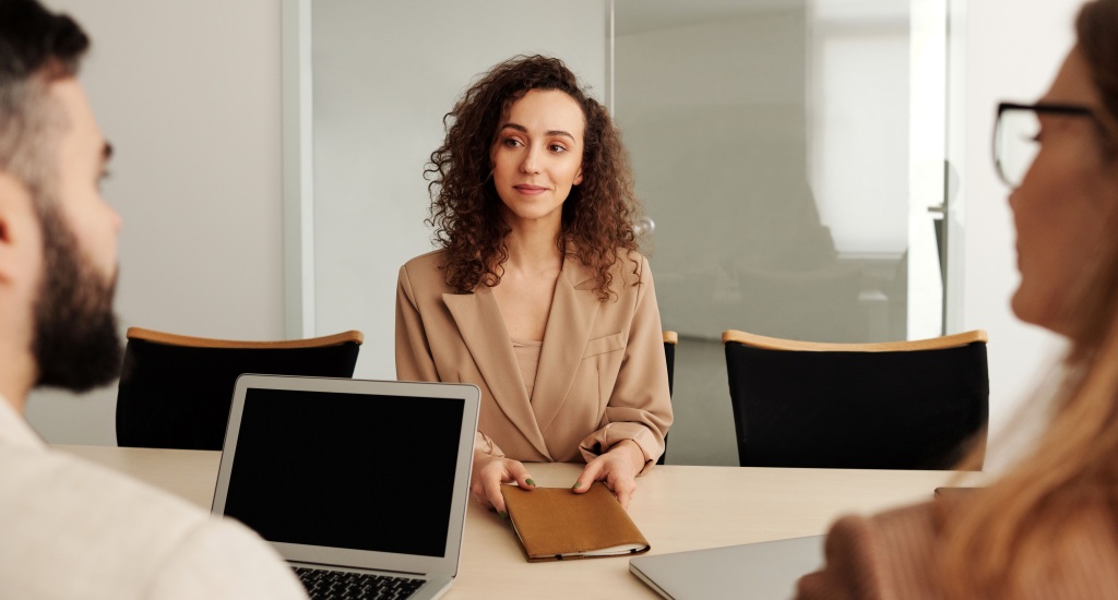 An unemployed worker disclosing her previous bankruptcy during her interview.