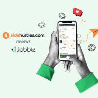 Two hands holding a smartphone displaying available jobs in the Jobble app
