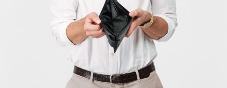 Man showing the inside of his empty wallet.