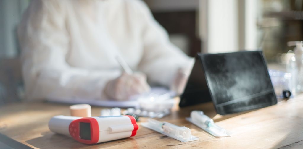 A medical professional reviewing transcript generated by an AI medical scribe.