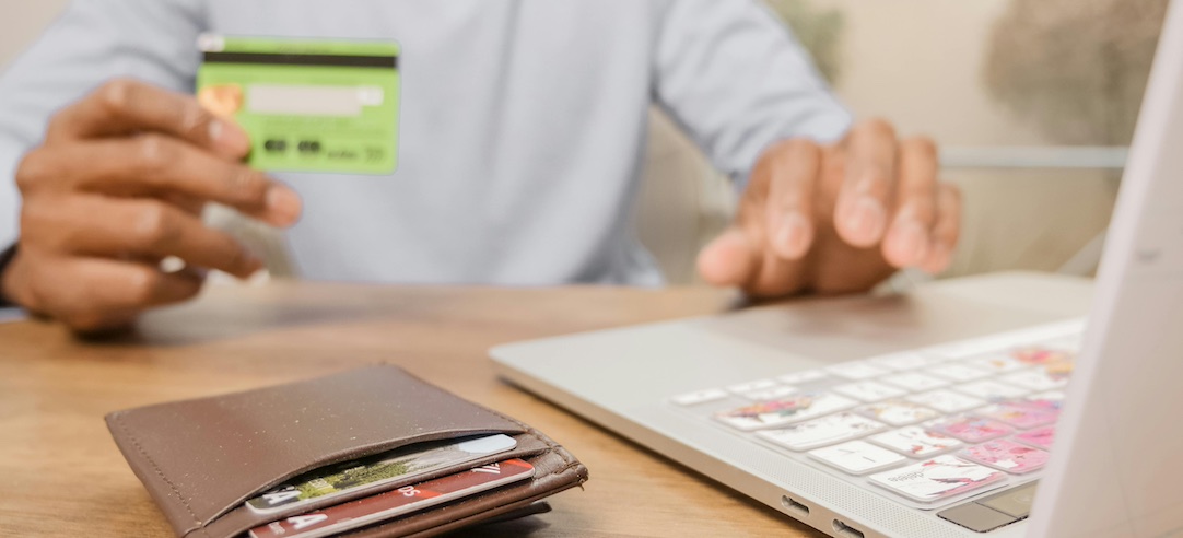 Image of a person paying for something online with their credit card.