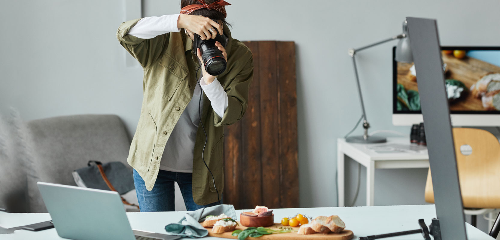 Woman taking a picture of food for her photography side hustle