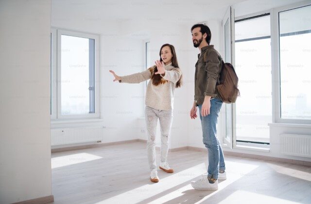 Residential interior designer in a house explaining the design process to a client