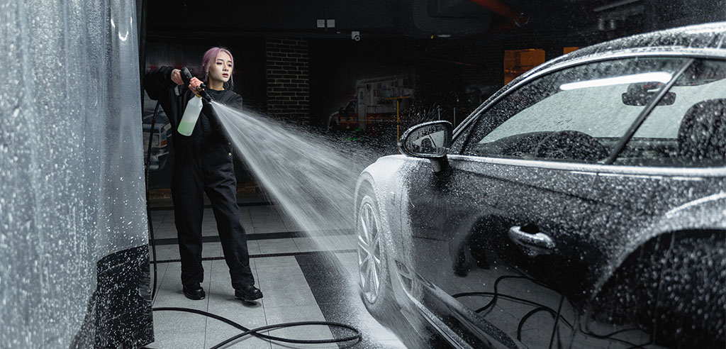 a woman is running a car washing business