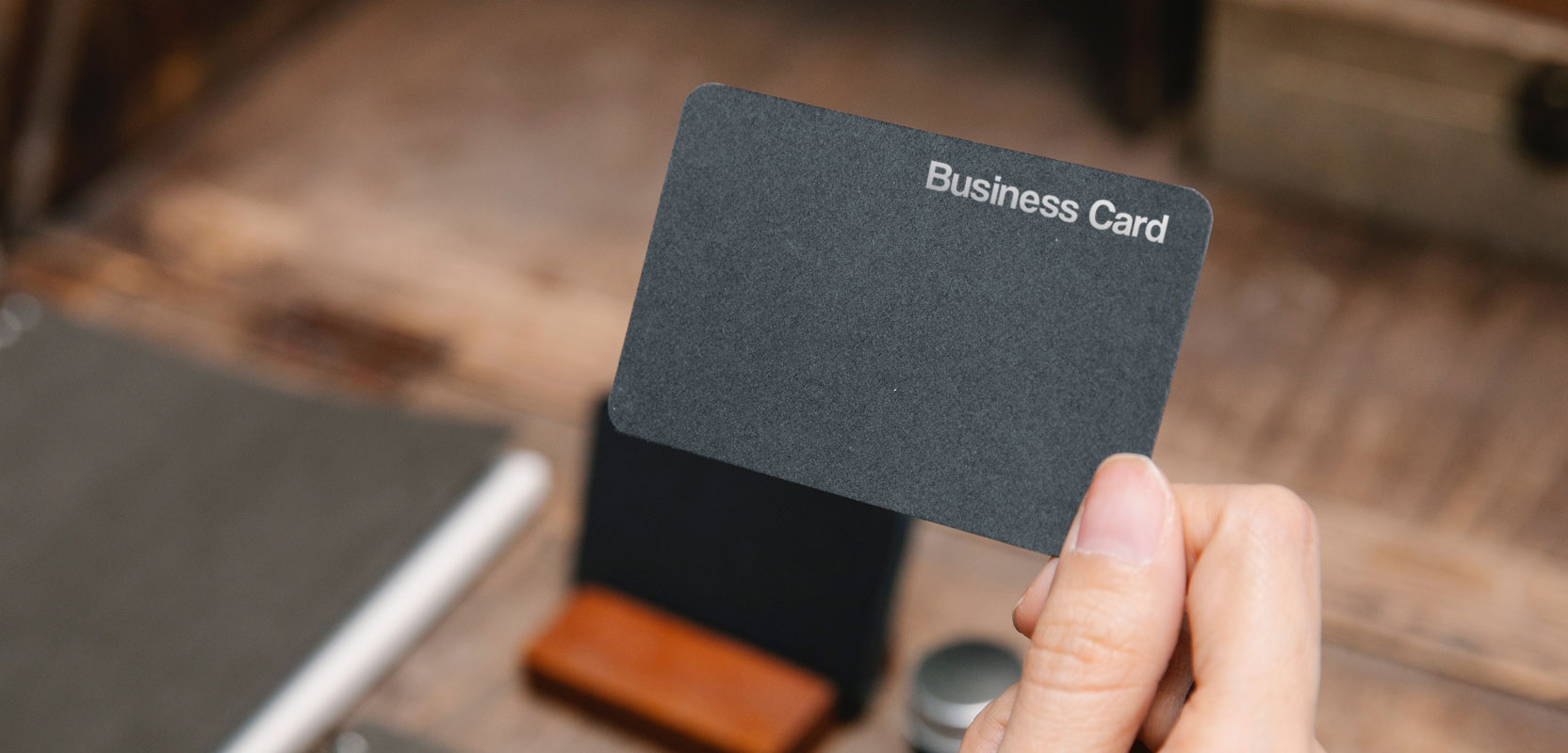 Closeup of someone holding a blank business card