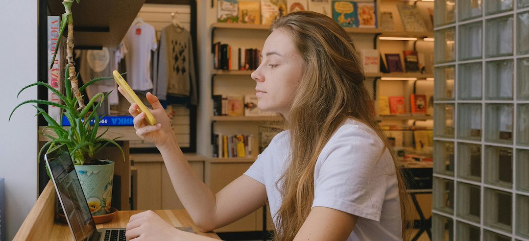 Remote worker recording her virtual meeting with an AI note-taking app.