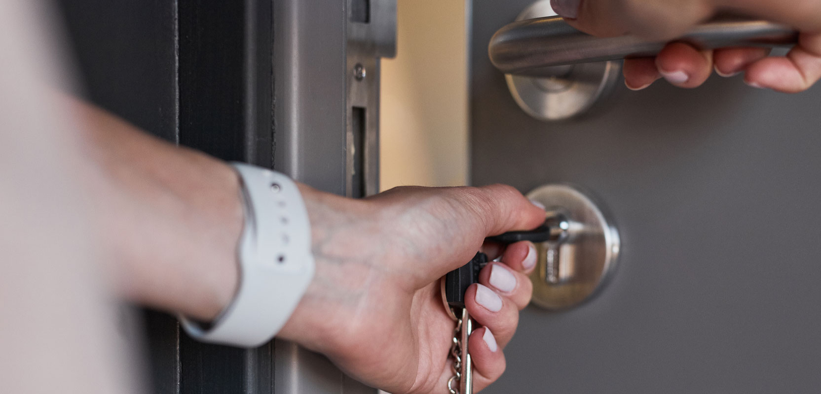 Person unlocking a door for a renter