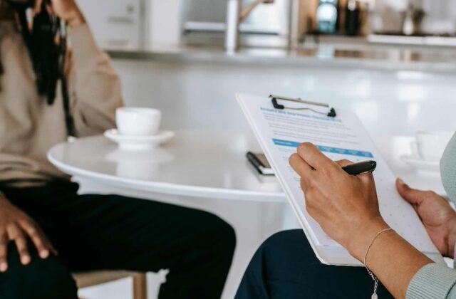 Woman being evaluated by a reverse recruiter.