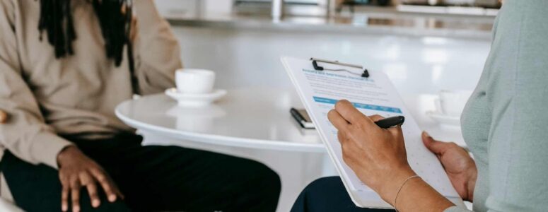 Woman being evaluated by a reverse recruiter.