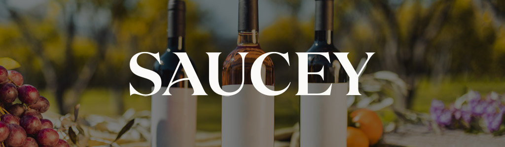 Saucey logo against a background of bottles of wine on a patio table 